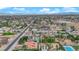 Scenic aerial shot highlighting the neighborhood's mature trees, landscaping, and swimming pools at 3065 S Torrey Pines Dr, Las Vegas, NV 89146