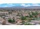 Wide aerial view displaying houses in a residential neighborhood, distant mountains in background at 3065 S Torrey Pines Dr, Las Vegas, NV 89146