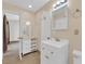 Well-lit bathroom with a white vanity, tiled floors, and ample storage at 3065 S Torrey Pines Dr, Las Vegas, NV 89146