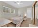 Cozy bedroom with a ceiling fan, a bright window, and a decorative bedspread at 3065 S Torrey Pines Dr, Las Vegas, NV 89146