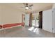 Bright bonus room with tiled floors, massage table, and access to patio at 3065 S Torrey Pines Dr, Las Vegas, NV 89146