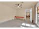 Relaxing bonus room with tiled floors, massage table, and access to patio at 3065 S Torrey Pines Dr, Las Vegas, NV 89146