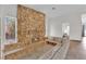 Living room with stone fireplace and built in seating area at 3065 S Torrey Pines Dr, Las Vegas, NV 89146