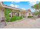Charming front entrance of this single-story home with a well-kept lawn and climbing vines at 3065 S Torrey Pines Dr, Las Vegas, NV 89146