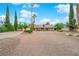 Charming single-story home with a large front yard and mature landscaping, creating a serene desert oasis at 3065 S Torrey Pines Dr, Las Vegas, NV 89146