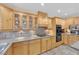 A closer view of the kitchen area with light wood cabinets and tile backsplash at 3065 S Torrey Pines Dr, Las Vegas, NV 89146