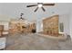 Open living area with large fireplace and access to the kitchen at 3065 S Torrey Pines Dr, Las Vegas, NV 89146