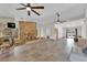 Spacious living area with stone fireplace, wet bar, and bright spaces at 3065 S Torrey Pines Dr, Las Vegas, NV 89146