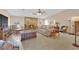 Inviting living room featuring a stone fireplace, ample natural light, and comfortable seating at 3065 S Torrey Pines Dr, Las Vegas, NV 89146