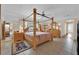 Spacious bedroom with a four-poster bed, ceiling fan and neutral color palette at 3065 S Torrey Pines Dr, Las Vegas, NV 89146