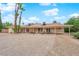 Inviting backyard with a covered patio, mature landscaping, and a tranquil setting perfect for relaxation at 3065 S Torrey Pines Dr, Las Vegas, NV 89146
