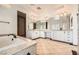 Bright bathroom featuring double vanities, soaking tub, and high-end fixtures at 3198 Stella Cilento Ave, Henderson, NV 89044
