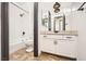 This bathroom features modern fixtures, sleek finishes, and a shower over tub combo at 3198 Stella Cilento Ave, Henderson, NV 89044