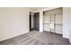 Carpeted bedroom with neutral walls, closet and gray door at 3198 Stella Cilento Ave, Henderson, NV 89044