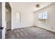 Bright bedroom with plush carpet, large windows for natural light, and a walk-in closet with built-in organizers at 3198 Stella Cilento Ave, Henderson, NV 89044