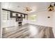 Spacious bedroom with custom built-ins, a large window offering natural light, and sleek hardwood flooring at 3198 Stella Cilento Ave, Henderson, NV 89044