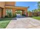 Arched driveway with stamped concrete and an automated gate at 3198 Stella Cilento Ave, Henderson, NV 89044
