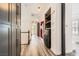 Bright hallway featuring hardwood style floors, recessed lighting, and washer/dryer at 3198 Stella Cilento Ave, Henderson, NV 89044