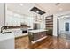 Modern kitchen with white cabinets, center island and stainless steel appliances at 3198 Stella Cilento Ave, Henderson, NV 89044