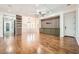 Open-concept living space with hardwood floors, built-in cabinets, and modern lighting at 3198 Stella Cilento Ave, Henderson, NV 89044