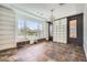 Bright home office featuring large windows, custom shelving, and stylish slate tile flooring at 3198 Stella Cilento Ave, Henderson, NV 89044