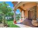 Inviting front porch with stone accents, manicured lawn, and lush landscaping at 3198 Stella Cilento Ave, Henderson, NV 89044