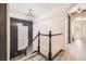 This staircase features decorative white railings and is brightly lit from the window at 3198 Stella Cilento Ave, Henderson, NV 89044