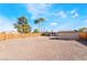Large barren backyard featuring wood fencing and a detached storage building at 343 Tungsten St, Henderson, NV 89015