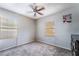 Light-filled bedroom with ceiling fan and windows with blinds for natural light at 343 Tungsten St, Henderson, NV 89015