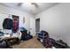 Neutral bedroom featuring an open closet with some clothes, and a doorway at 343 Tungsten St, Henderson, NV 89015