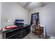 Bedroom with a black dresser, black curtains, carpet flooring and neutral colored walls at 343 Tungsten St, Henderson, NV 89015