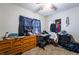 Bedroom featuring a wooden dresser, desk, and a closet with some clothes at 343 Tungsten St, Henderson, NV 89015
