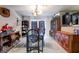 Bright dining room features tile floors, chandelier lighting, and dark accents at 343 Tungsten St, Henderson, NV 89015