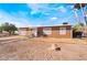 Charming single-story home with brown wood siding, complemented by a desert landscape and pathway to the entrance at 343 Tungsten St, Henderson, NV 89015