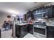 Modern kitchen featuring black cabinets and stainless steel appliances at 343 Tungsten St, Henderson, NV 89015