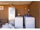 Outdoor laundry area equipped with washer, dryer, and utility closet at 343 Tungsten St, Henderson, NV 89015