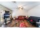 Spacious living room featuring wood floors, a ceiling fan, and ample natural light at 343 Tungsten St, Henderson, NV 89015
