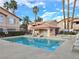 Community pool with sun loungers and inviting surroundings at 350 S Durango Dr # 220, Las Vegas, NV 89145