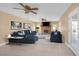 Spacious living room featuring neutral tones, modern decor, and a cozy brick fireplace at 3558 Wayne Cir, Las Vegas, NV 89121