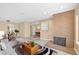 Bright living room with brick fireplace and dining area at 3558 Wayne Cir, Las Vegas, NV 89121