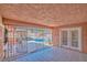 Enclosed patio with tile floor, a view of the pool, and access to the backyard at 3558 Wayne Cir, Las Vegas, NV 89121