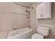 Functional bathroom design featuring a tub with shower, white tiled walls, and essential fixtures at 3753 S Rosecrest Cir, Las Vegas, NV 89121