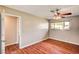 Bedroom with hardwood floors, ceiling fan, and a window allowing for natural light at 3753 S Rosecrest Cir, Las Vegas, NV 89121