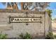 Entrance sign to Paradise Crest neighborhood featuring decorative brickwork and lush greenery at 3753 S Rosecrest Cir, Las Vegas, NV 89121