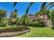A lovely single-story home with a tile roof, well-manicured lawn and landscaped yard at 3753 S Rosecrest Cir, Las Vegas, NV 89121