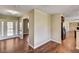 Inviting foyer with hardwood floors, decorative glass front door, and views into the living spaces at 3753 S Rosecrest Cir, Las Vegas, NV 89121