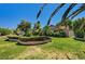 Beautiful landscaped front yard with mature trees and manicured bushes framing a well-kept home at 3753 S Rosecrest Cir, Las Vegas, NV 89121