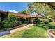 Charming single-story home with a well-maintained lawn, mature landscaping, and brick accents at 3753 S Rosecrest Cir, Las Vegas, NV 89121