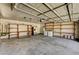Spacious garage with built-in storage shelves, utility sink, and ample room for vehicles and projects at 3753 S Rosecrest Cir, Las Vegas, NV 89121