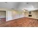 Bright living room with stone fireplace and wood flooring, great for entertaining at 3753 S Rosecrest Cir, Las Vegas, NV 89121